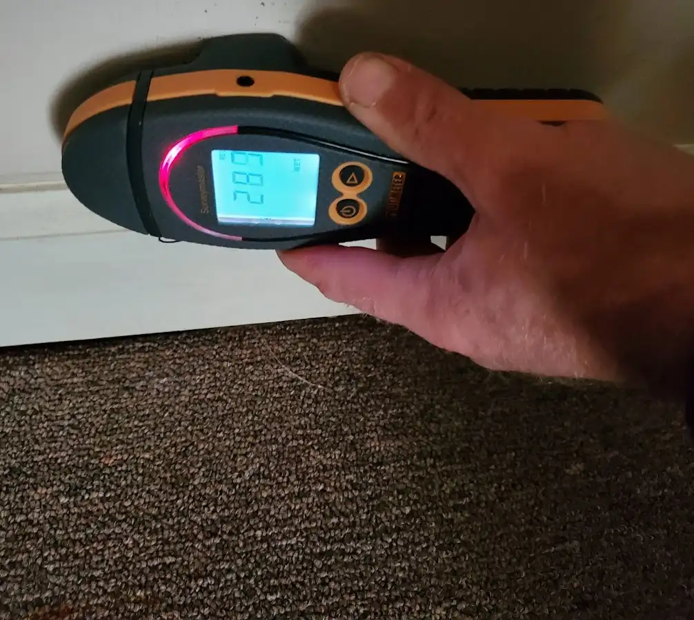 Moisture detection at baseboard during Storm Damage Restoration in Somerset